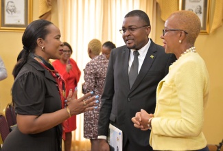 Minister of Education and Youth, Hon. Fayval Williams (right), and Minister without Portfolio in the Office of the Prime Minister with Responsibility for Information, Hon. Robert Morgan (centre), listen to a point being made by Permanent Secretary in the Ministry of Education and Youth, Dr. Kasan Troupe, during Wednesday’s (April 17) post-Cabinet press briefing at Jamaica House.

