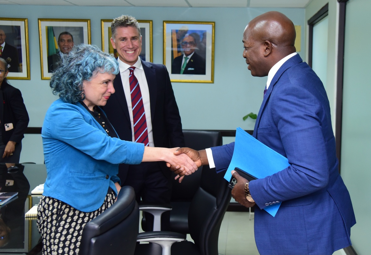 Minister of Labour and Social Security, Hon. Pearnel Charles Jr. (right), greets Head of Programme, World Food Programme Caribbean Multi-Country Office, Sarah Bailey (left) during a courtesy call at the Ministry’s 1F North Street offices in Kingston on May 2. Looking on is Head of World Food Programme Office (Jamaica), Dana Sacchatti.