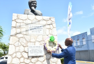 Minister of Labour and Social Security, Hon. Pearnel Charles Jr. places a wreath at the Agnes “Aggie” Benard Monument, downtown Kingston, during the National Workers’ Week/Labour Day wreath-laying ceremony on Tuesday (May 21) . The monument pays tribute to Jamaicans who participated in the 1938 labour strike, which have resulted in improved work conditions for today’s workers. National Workers’ Week, under the theme ‘Recognising abilities, fostering greater inclusion of our workers’, culminates with the observance on Labour Day on May 23.

