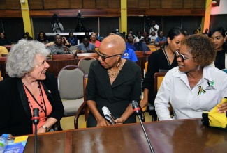 Minister of Education and Youth, Hon. Fayval Williams (centre), converses with World President of the World Organization for Early Childhood Education, Mercedes Mayol Lassalle (left), during the closing ceremony of the Early Childhood Commission’s (ECC) 5th Annual Professional Development Institute at the Jamaica Conference Centre, downtown Kingston on Friday (May 24). Looking on is Executive Director of the Early Childhood Commission (ECC), Dr. Karlene Deslandes.