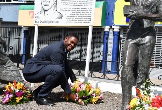 Mayor of Montego Bay, Councillor Richard Vernon, places flowers at the monument in Sam Sharpe Square, Montego Bay, St. James, in honour of National Hero, the Right Excellent Samuel Sharpe, on Labour Day, Thursday (May 23).

