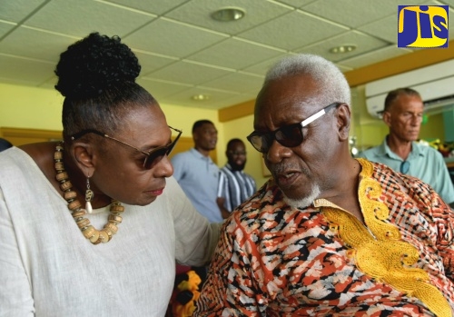 Minister of Culture, Gender, Entertainment and Sport, Hon. Olivia Grange, speaks with former Prime Minister, the Most Hon. PJ Patterson, during Saturday’s (May 25) T20I Cricket Match between West Indies and South Africa at Sabina Park in Kingston.