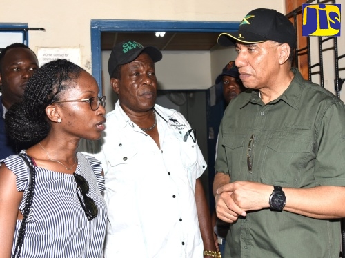 Prime Minister, the Most Hon. Andrew Holness (right), conversing with medical doctor at the Olympic Gardens Health Centre, Dr. April Fairclough (left) and Councillor Caretaker, Molynes Gardens Division, Glendon Salmon, during the Prime Minister’s visit to the Olympic Gardens Health Centre in Kingston to participate in Labour Day (May 23) activities.