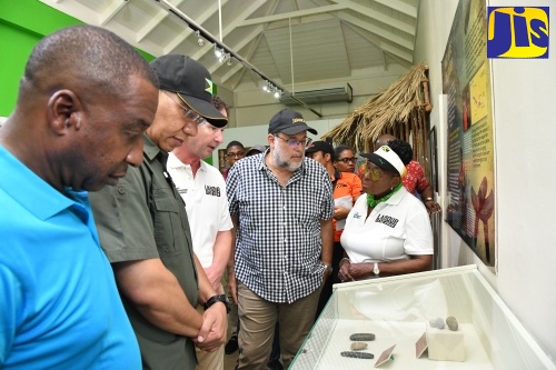 Prime Minister, the Most Hon. Andrew Holness (second left) along with Mayor of Kingston, His Worship Councillor Andrew Swaby (left); Leader of the Opposition, Mark Golding (second right) and Minister of Culture, Gender, Entertainment and Sport, Hon. Olivia Grange (right) look at artefacts at the National Museum of Jamaica, while Director, National Museum of Jamaica, Dr. Jonathan Greenland (centre) provides details. Occasion was a tour of the facility today (May 23) in downtown Kingston.