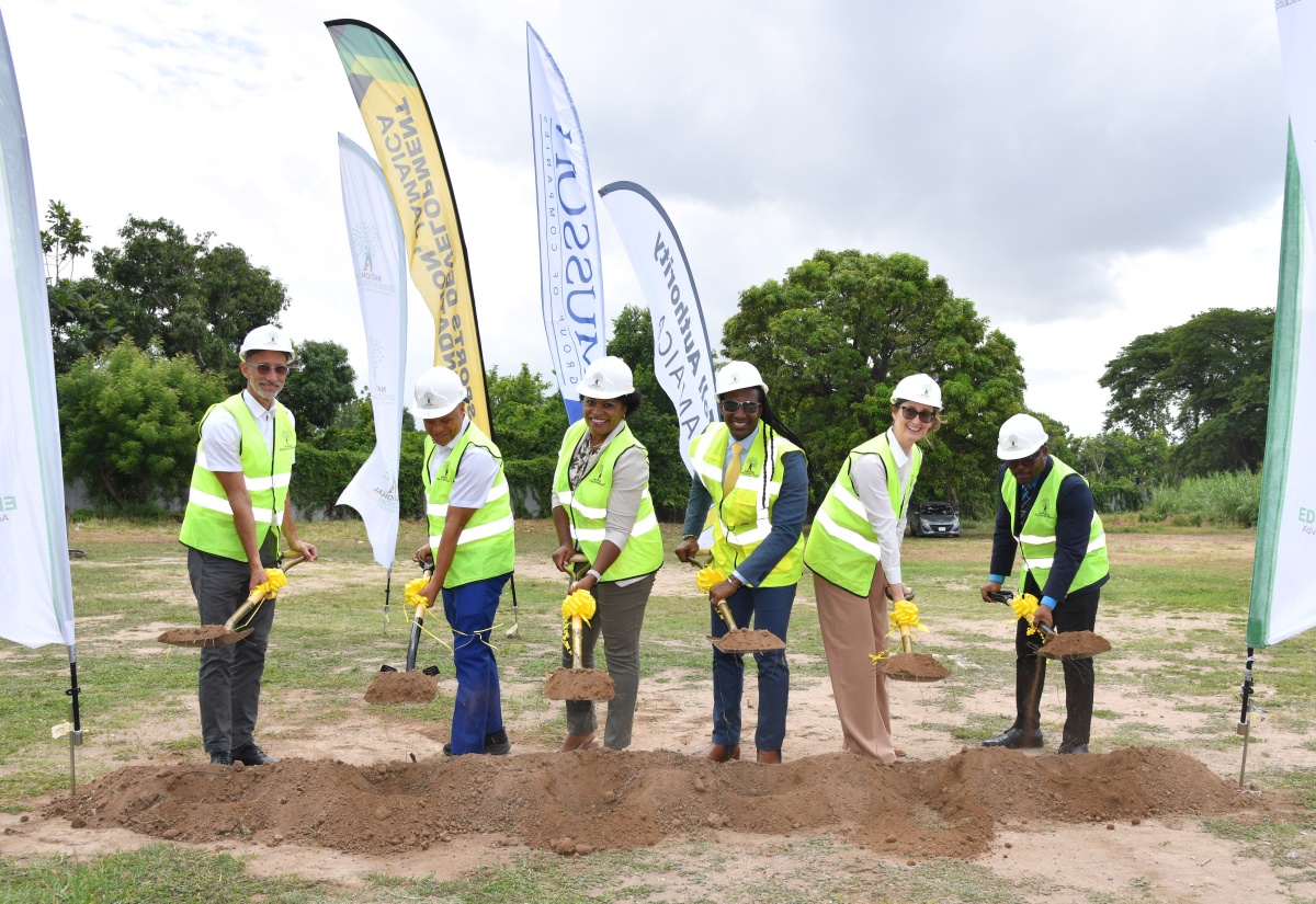 State Minister for Foreign Affairs and Foreign Trade, and Member of Parliament for St. Catherine East Central, Hon. Alando Terrelonge (third right), participates in the breaking of ground for the construction of a multipurpose court at the Gregory Park Primary School in St. Catherine on Wednesday (May 29). Joining him are (from left) Sports Development Foundation General Manager, Alan Beckford; Director of the Toll Authority, Patrick Rose; Executive Director of the National Education Trust (NET), Latoya Harris Ghartey; Chairman of Musson Foundation, Melanie Subratie; and Principal of Gregory Park High School, Richard Williams.
