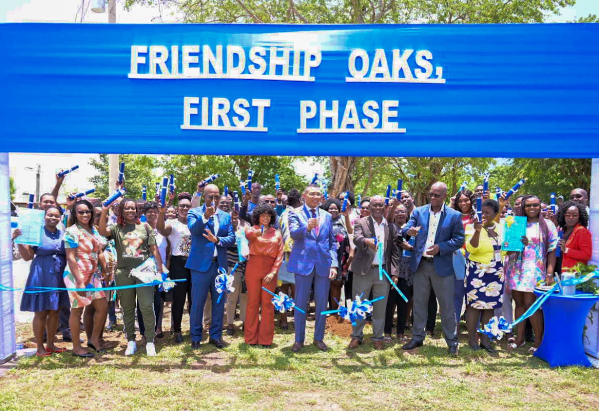 Prime Minister Holness Hands Over 106 Titles To Beneficiaries Of Serviced Lots In Friendship Oaks Phase One