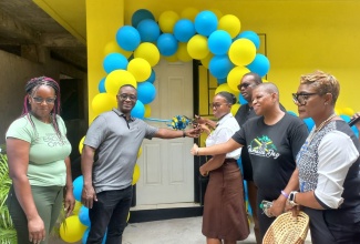 President, Parent-Teacher Association, Black River High School, Camar Green-Clarke (left), along with (from second left) President of the Jamaica Association of Montreal, Mark Henry; President of the Student Council of Black River High School, Dedrianna Farquharson; Jamaica's Honorary Consul to the High Commissioner in Montreal, George Grant; First Vice President of Jamaica Association of Montreal, Sharon Nelson; and Vice Principal Black River High School, Andria Strong -Moses participate in the official opening of the newly renovated female bathroom at the school, on June 20.