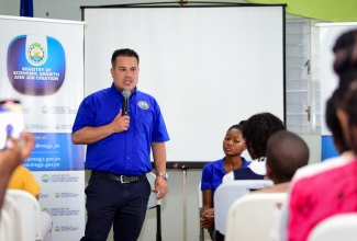 Minister without Portfolio in the Ministry of Economic Growth and Job Creation, Senator the Hon. Matthew Samuda, addressing students who visited the Port Royal Marine Lab in Kingston on June 6 in celebration of World Oceans Day.

