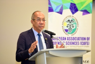 Deputy Prime Minister and Minister of National Security, Hon. Dr. Horace Chang, addresses the Caribbean Association of Forensic Sciences (CAFS) Conference at the AC Marriot Hotel in Kingston, on June 10.