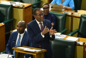 Minister of Finance and the Public Service, Dr. the Hon. Nigel Clarke, delivers a statement during Tuesday’s (June 11) sitting of the House of Representatives.

