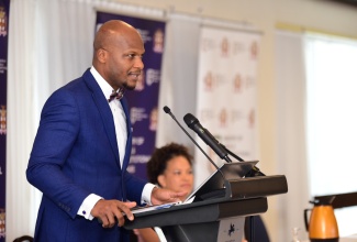 Permanent Secretary in the Ministry of Legal and Constitutional Affairs, Wayne Robertson, addresses a Legislative Policy Development Forum at The Jamaica Pegasus hotel in New Kingston on Thursday (June 13).