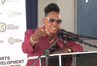 Minister of Culture, Gender, Entertainment and Sport, Hon. Olivia Grange, addresses the official handover of a multipurpose court at Christel House in St. Catherine, on June 4.