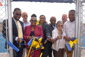 Minister of Culture, Gender, Entertainment and Sport, Hon. Olivia Grange (third left), and Minister of State in the Ministry of Education and Youth, Hon. Marsha Smith (fourth left), lead in the ribbon-cutting at the multipurpose court at the tuition-free Christel House, at Twickenham Park, St. Catherine, today (June 4). Others pictured (from left) are Executive Principal of the school, Jason Scott; General Manager of the Sport Development Foundation of Jamaica, Alan Beckford;  Custos of Kingston and Chairman of the school, Hon. Steadman Fuller; National Ambassador for Christel House Jamaica, Sally Porteous; and Councillor for the Westchester Division, Renair Benjamin, who represented Mayor of Spanish Town, Councillor Norman Scott.