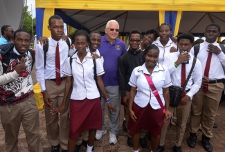 Minister of Justice, Hon. Delroy Chuck (centre), with students at the Legal Aid Council justice fair for persons with disabilities, which was held at Emancipation Park in New Kingston on Friday (June 21).