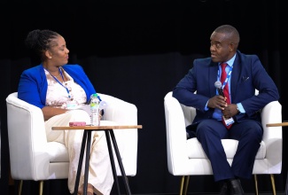 Commissioner of Police, Dr. Kevin Blake (right), participates in a Riverside Chat during the 10th Biennial Jamaica Diaspora Conference at the Montego Bay Convention Centre in St. James on June 17. The session was moderated by media personality, Dahlia Harris.