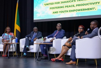 Chief Technical Director in the Ministry of National Security, Delroy Simpson (right), speaking during a session at the 10th Biennial Jamaica Diaspora Conference held at the Montego Bay Conference Centre in St. James on Monday (June 17). Others (from left) are Head of the Ministry’s Corporate Services Division, Elaine Oxamendi Vicet; Military Strategist, Kevin Junior; Deputy Police Commissioner, Fitz Bailey, and Chief Technical Director in the Ministry, Shauna Trowers.