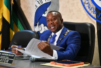 Mayor of Kingston, Councillor Andrew Swaby, addresses today’s (June 11) meeting of the Kingston and St. Andrew Municipal Corporation (KSAMC), at 24 Church Street in downtown Kingston.

