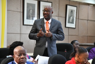 Councillor for the Papine Division, Darrington Ferguson, making his contribution to the resolution to name 16 roads in the community of Goldsmith Villa, August Town, during Tuesday’s (June 11) meeting of the Kingston and St. Andrew Municipal Corporation (KSAMC) at the Council’s chambers in downtown Kingston.