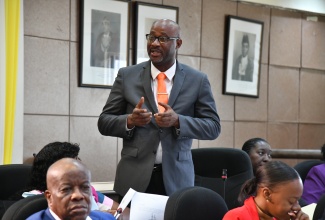 Councillor for the Papine Division, Darrington Ferguson, making his contribution to the resolution to name 16 roads in the community of Goldsmith Villa, August Town, during Tuesday’s (June 11) meeting of the Kingston and St. Andrew Municipal Corporation (KSAMC) at the Council’s chambers in downtown Kingston.
