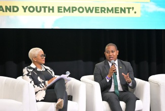 Minister of Agriculture, Fisheries and Mining, Hon. Floyd Green, fields questions from host, Debbie Bissoon, at the ‘Riverside Chat’, held during the 10th Biennial Jamaica Diaspora Conference, at the Montego Bay Convention Centre, on June 18. The Conference is being held from June 16 to June 19.


