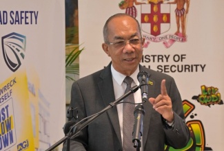 Minister of National Security, Hon. Dr. Horace Chang, addresses the handover of 2,000 helmets donated by the Government, through the Ministry, to the National Helmet Wearing Coalition (NHWC) at the corporate offices of the Jamaica National (JN) Group on Oxford Road in St. Andrew on Wednesday (June 12).