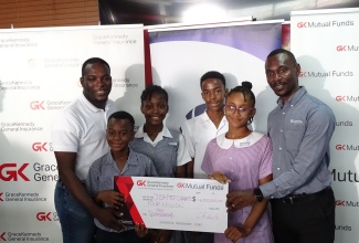 Daniel Thompson (left) General Manager of GraceKennedy Mutual Funds and Chaluk Richards (right), General Manager of GraceKennedy Insurance, hand over a cheque valued at $4 million towards the JISA Prep School Championship during the recently held media launch at the Ministry' head office. Sharing in the moment are students of Mona Preparatory School Matteo Plummer (second left) and Ruth-Ann Sloley (third left) and students of Sts Peter and Paul Preparatory School – Donovan James (third right) and Anya Johnson (second right).


