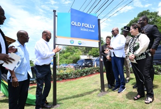 Tourism Minister, Hon. Edmund Bartlett (fourth right), is joined by other tourism stakeholders in officially opening the newly refurbished Old Folly Scenic Park in Discovery Bay, St. Ann, on May 31.
