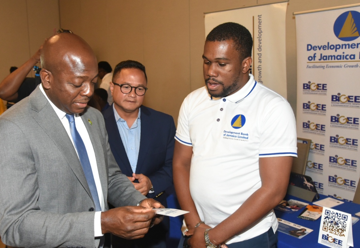 Minister of Labour and Social Security, Hon. Pearnel Charles Jr. (left) and Chairman, Jamaica Productivity Centre, Omar Azan (centre), engage with Relationship Executive, Development Bank of Jamaica, Travell Mullings, during the Future of Work and Productivity seminar at the AC Kingston Hotel in St. Andrew on June 20. The event is being held under the theme ‘Bridging the Innovation and Productivity Gaps: Education, Skills and Economic Transformation’.