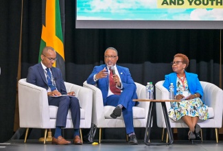 Permanent Secretary in the Ministry of Health and Wellness, Dunstan Bryan, addresses a session on ‘Transforming Jamaica’s Health System in Partnership with the Diaspora’ during the 10th Biennial Jamaica Diaspora Conference in Montego Bay on Monday (June 17). He is flanked by Sector Lead for Health and Wellness in the Global Jamaica Diaspora Council (GJDC), Dr. Gary Rhule (left), and member of the Jamaica Nurses Group in New York, United States (US), Claudette Powell.

