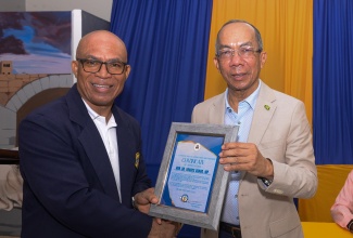 Prayer 6

Deputy Prime Minister and Minister of National Security, Hon. Dr. Horace Chang (right), is presented with a Certificate of Appreciation by Chairman, St. Catherine Baptist Association Brotherhood, Dr. Kirkland Anderson, after delivering the keynote address during Saturday’s (June 8) fourth anniversary prayer breakfast fundraiser at Phillippo Baptist Church in Spanish Town, St. Catherine.