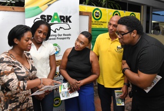 Director, Constituency Development Fund (CDF), Kedesha Rochester (left) explains the Shared Prosperity through Accelerated Improvement to Our Road Network (SPARK) Programme to (from second left) Keystone Community Development Committee member, Kourtnie Dixon; Member of Parliament for St. Catherine Eastern, Denise Daley; Director, Major Projects, National Works Agency (NWA), Richard McHargh; and Parish Manager, Social Development Commission (SDC) St. Catherine, Samuel Heron, during a SPARK Programme consultation meeting held at the SDC St. Catherine Parish Office on May 31.