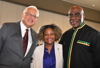Justice Minister, Hon. Delroy Chuck (left), shares a moment with Minister without Portfolio in the Office of the Prime Minister with oversight for Skills and Digital Transformation, Senator the Hon. Dr. Dana Morris Dixon, and Chief Justice, Bryan Sykes, at the opening reception of the Chief Justices and Heads of Judiciaries of the Caribbean Conference 2024 on June 19 at the AC Marriott Hotel in Kingston.

