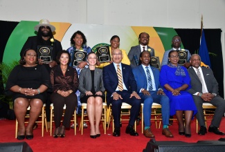 Governor-General, His Excellency the Most Hon. Sir Patrick Allen (seated, centre), with recipients and several stakeholders during the 2024 Governor-General Diaspora Achievement Awards ceremony at the Montego Bay Convention Centre in St. James on June 19. Also with the awardees are: Minister of Foreign Affairs and Foreign Trade, Senator the Hon. Kamina Johnson Smith (seated, third left); Jamaica’s Ambassador to the United States, Her Excellency Audrey Marks (seated, second left); and State Minister in the Ministry of Foreign Affairs and Foreign, Hon. Alando Terrelonge (seated, third right). 

