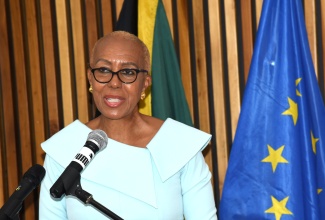 Minister of Education and Youth, Hon.  Fayval Williams, addresses the handover of a cheque for $4.5 million by the European Union (EU) to facilitate the staging of three literacy summer camps in Kingston for primary-school students. The official handover ceremony was held on June 25 at the offices of the European Union Delegation in Kingston.