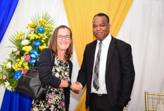 Director, Corruption Prevention, Stakeholder Engagement and Anti-Corruption Strategy, Integrity Commission, Ryan Evans, greets British High Commissioner to Jamaica, Her Excellency Judith Slater, at a National Consultation Workshop held at the Terra Nova All-Suite Hotel in Kingston on Friday (July 19). The workshop was organised by the Integrity Commission.

