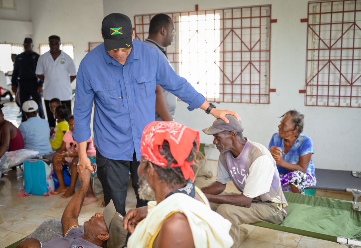 Prime Minister, the Most Hon. Andrew Holness, greets elderly residents of Rocky Point, Clarendon, during a visit to the community centre on Saturday (July 6). The facility is serving as a shelter for displaced citizens following the passage of Hurricane Beryl.
