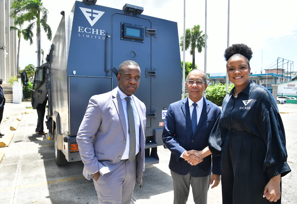 Deputy Prime Minister and Minister of National Security, Hon. Dr. Horace Chang (centre), shakes hands with Founder and Chief Executive Officer (CEO) of ECHE Limited, Lititia Myers Gray (right), during a visit by Ms. Gray to the Ministry’s offices in Kingston on Wednesday (July 17), to showcase the company’s newly acquired fleet of armored vehicles. Sharing the moment is Commissioner of Police, Dr. Kevin Blake.

