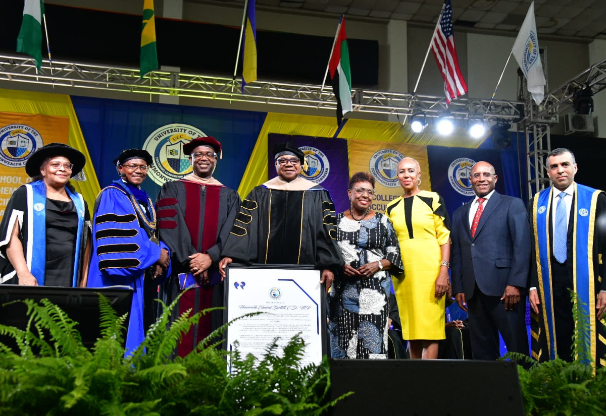 Minister of Tourism, Hon. Edmund Bartlett (fourth left), who received an Honorary Doctorate in Hospitality and Tourism Management from the University of the Commonwealth Caribbean (UCC), at a graduation ceremony, held at the National Arena, on Sunday (July 28), shares a  photo opportunity with (from left) Deputy Group Executive Chairperson of the University of the Commonwealth Caribbean (UCC), Geraldine Adams; President of the UCC, Professor Colin Gyles; Group Executive Chairman of UCC, Dr. Winston Adams; Minister of Culture, Gender, Entertainment and Sport, Hon. Olivia Grange; Minister of Education and Youth, Hon. Fayval Williams; Minister of Industry, Investment and Commerce, Senator the Hon. Aubyn Hill, and President of Strategic Holdings Group, His Excellency Dawood Al Shezawi.
