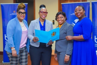 Permanent Secretary in the Ministry of Education and Youth, Dr. Kasan Troupe (centre), is joined by (from left) Project Lead for the Transforming Education for National Development (TREND) at the Ministry, Nicole Brown; Acting Chief Educational Transformation Officer, Sophia Forbes-Hall; and Director of Communications and Public Relations, Ruth Ann Carr, at a recent TREND stakeholders meeting for business leaders at the University of the West Indies (UWI) Regional Headquarters in St. Andrew.

