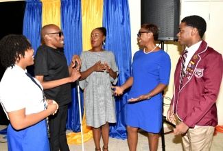 Minister of State in the Ministry of National Security, Hon. Juliet Cuthbert-Flynn (second right), engages with (from left) National Secondary Students’ Council (NSSC) Region 5 Vice President, Anna-Ruth Parchment; Founder and Executive Director of the Jamaican Association for Debating and Empowerment (JADE), Germaine Barrett; media personality, Empress Golding; and Vice President of the NSSC for Region 3, Oshane Hall. Occasion was the National Taskforce Against Trafficking in Persons (NAFATIP) Youth Symposium held at the University of Technology (UTech) campus in Kingston on Tuesday (July 30).

