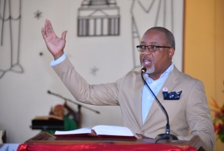 Permanent Secretary in the Ministry of Health and Wellness, Dunstan Bryan, leads the congregation of Sts. Peter and Paul Roman Catholic Church in St. Andrew in the singing of a hymn during Sunday’s (July 21) Healthcare Workers Appreciation Month National Church Service. The Month is being observed throughout July. This is the third year that the Month is being commemorated, following a Proclamation by Governor-General, His Excellency the Most Hon. Sir Patrick Allen, in 2022.