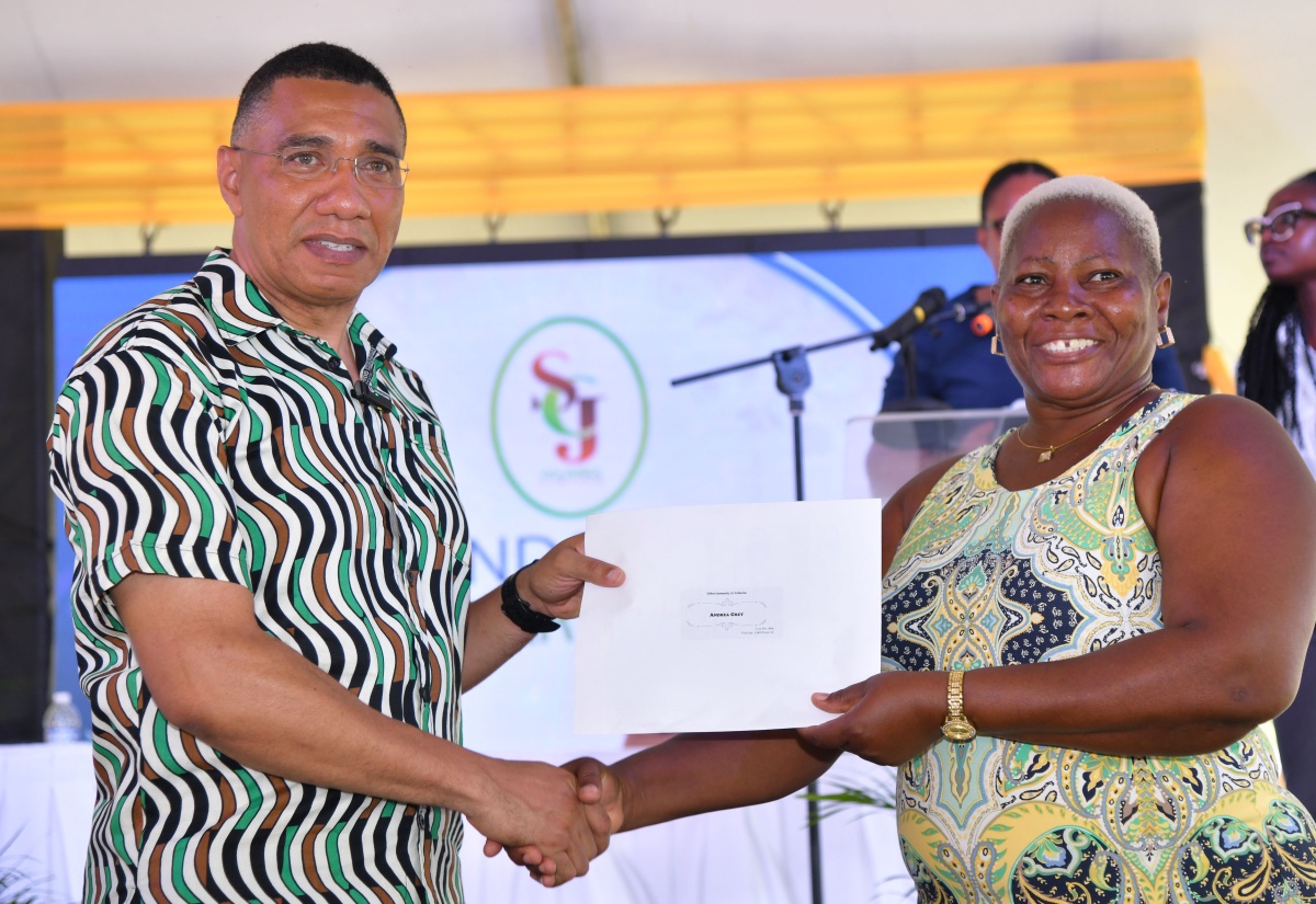 PM Hands Over 300 Land Titles to Residents of Clifton