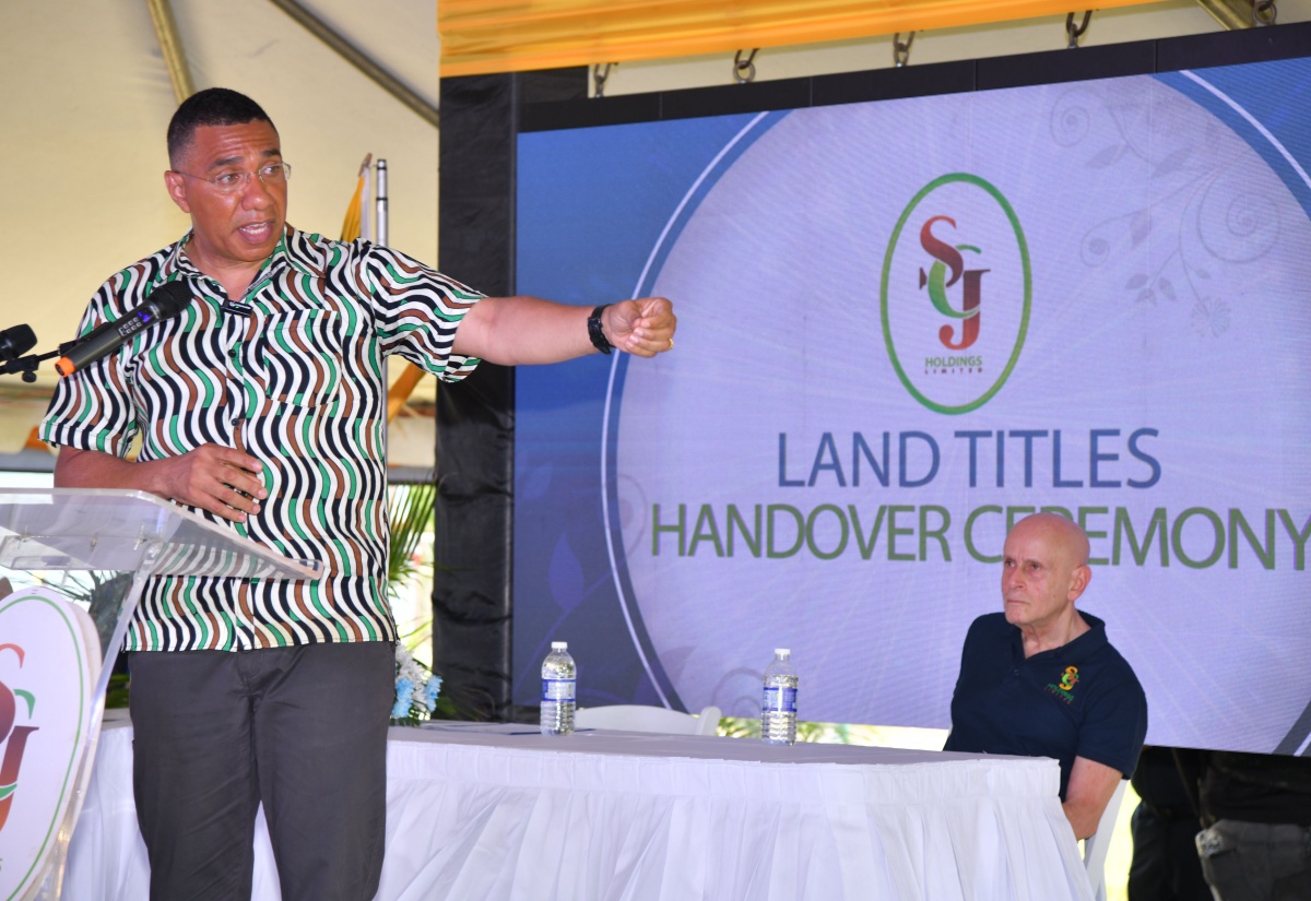 PM Hands Over 300 Land Titles to Residents of Clifton