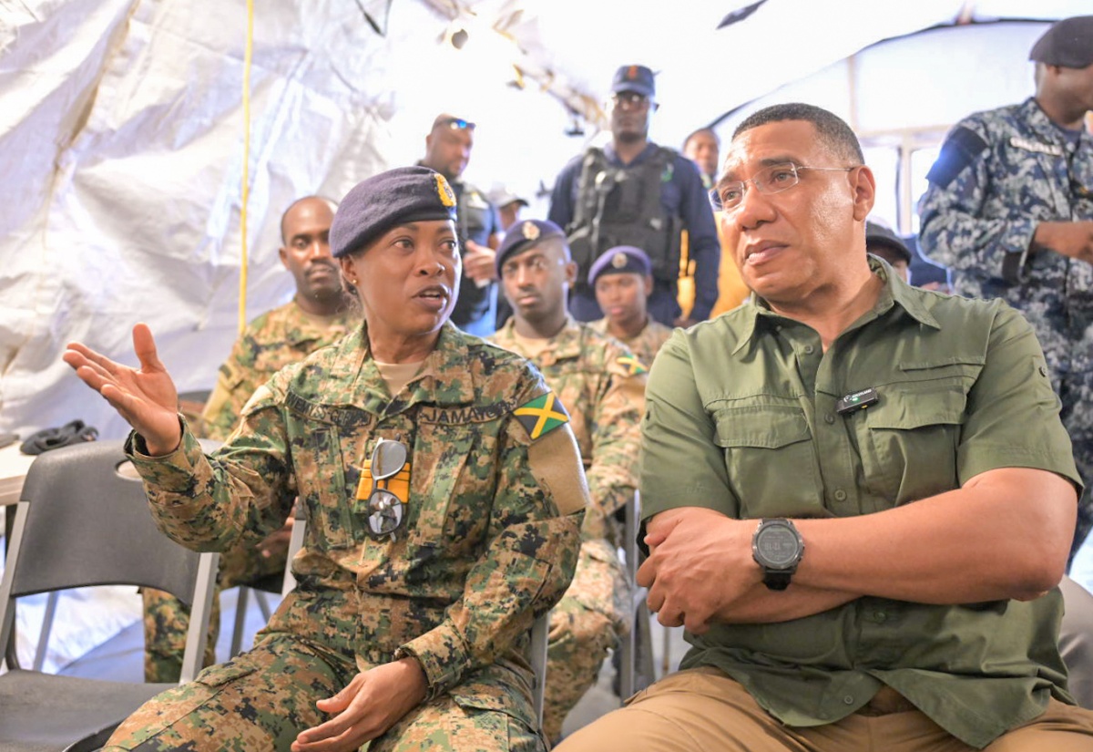 Prime Minister the Most Hon. Andrew Holness (right) is briefed by Chief of Defence Staff (CDS), Vice Admiral Antonette Wemyss Gorman, during a visit to the Jamaica Defence Force (JDF) site in Rocky Point, Clarendon today (July 13). The JDF, including members of the Disaster Assistance Relief Team (DART), has been on the ground providing emergency assistance, clearing debris, and restoring essential services, following the passage of Hurricane Beryl on July 3.