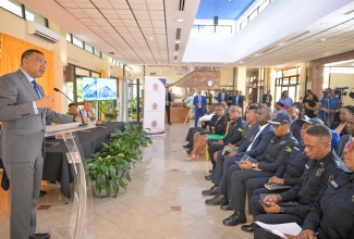 Prime Minister, the Most Hon. Andrew Holness, addressing the contract-signing ceremony for the new St. Catherine North Divisional Headquarters for the Jamaica Constabulary Force (JCF), at the Office of the Prime Minister in St. Andrew on July 23.
