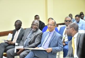 Deputy Prime Minister and Minister of National Security, Hon. Dr. Horace Chang ( second right), converses with Custos Rotulorum for St. James, Bishop the Hon. Conrad Pitkin (second left), and University of Technology (UTech) President, Dr. Kevin Brown (right), during the UTech Western Campus’ recent Science, Technology, Engineering and Mathematics (STEM) Summer Camp launch. The event was held at the campus in Montego Bay, St. James. At left is Montego Bay Chamber of Commerce and Industry (MBCCI) President, Oral Heaven.

