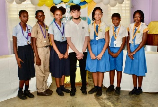 Conceptualiser of the proposed debating competition between primary-level students in St. Ann next year, 18-year-old Ayran Lakhwani (centre), with members of Exchange All-Age School (from left) Shevanique Tennant, Nathan Pryce, and Neveikia Beecher, and students from United Learning Centre (ULC) Preparatory School, Gabrielle Francis; Anri Grant, and Akeliah Baugh.    

