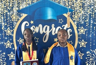 Top Girl at the Portland based Buff Bay Primary School, Alesha Grant (left), and Top Boy and Student at the institution, Jeashawn Williams, at the recent graduation ceremony.

