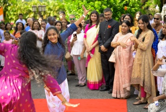 High Commissioner of India to Jamaica, His Excellency Mayank Joshi (fourth left) and his wife, Isha Joshi (fifth right), observe a cultural presentation to mark India’s 78th Independence Day celebrations on Thursday (August 15), at India House, Kingston.

