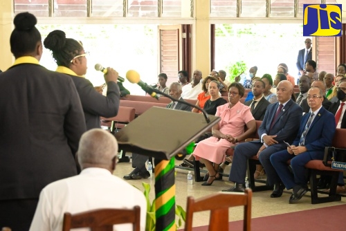 Deputy Prime Minister and Minister of National Security, Hon. Dr. Horace Chang (right, front row), listens as the Jamaica Constabulary Force (JCF) choir performs during the Major Organised Crime and Anti-Corruption Agency’s (MOCA) 10th anniversary service at Boulevard Baptist Church in St. Andrew on Sunday (August 11), which kicked off a slate of commemorative activities. Dr. Chang delivered remarks during the service. Also listening are MOCA’s Director-General, Colonel Desmond Edwards (second right, front row), and Permanent Secretary in the Ministry of National Security, Ambassador Alison Stone Roofe (third right, front row).